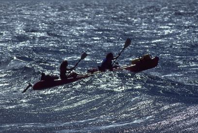 Kayaks riding the waves